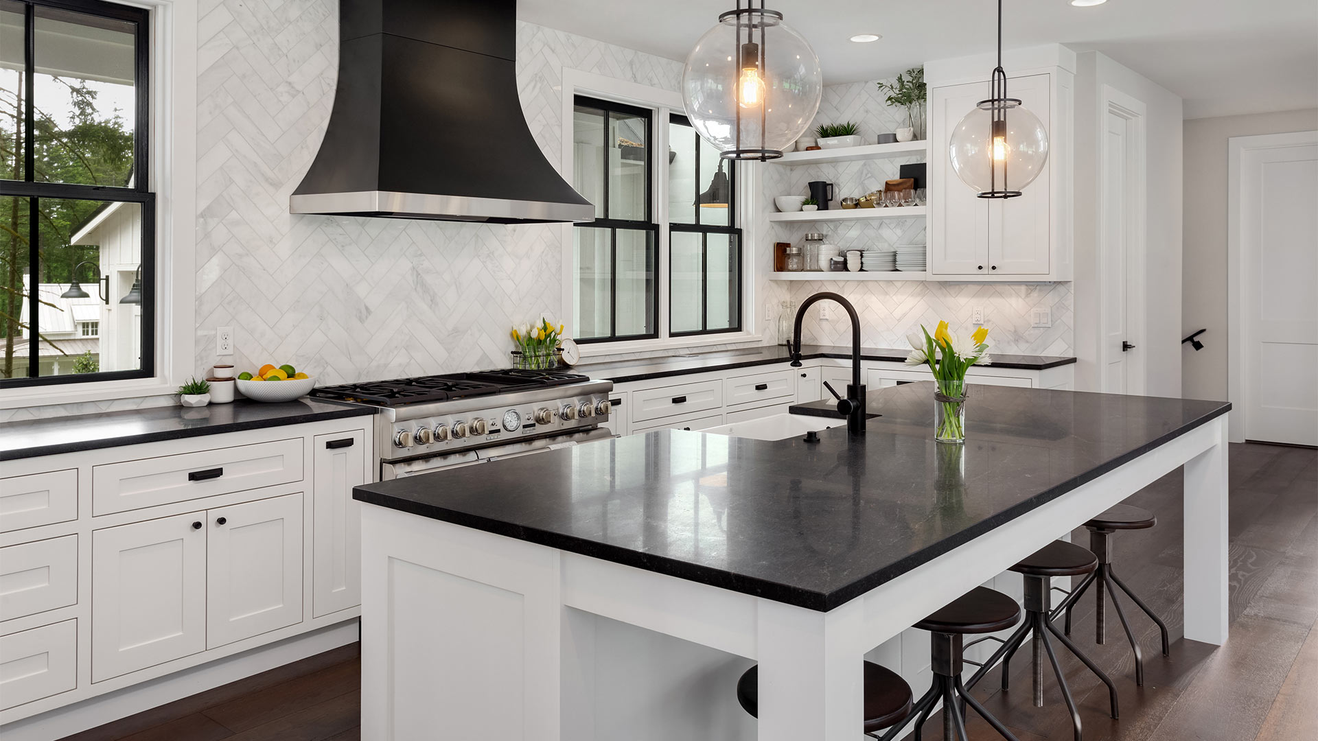 kitchen interiors with white cabinets and backsplash and black fixtures everett wa