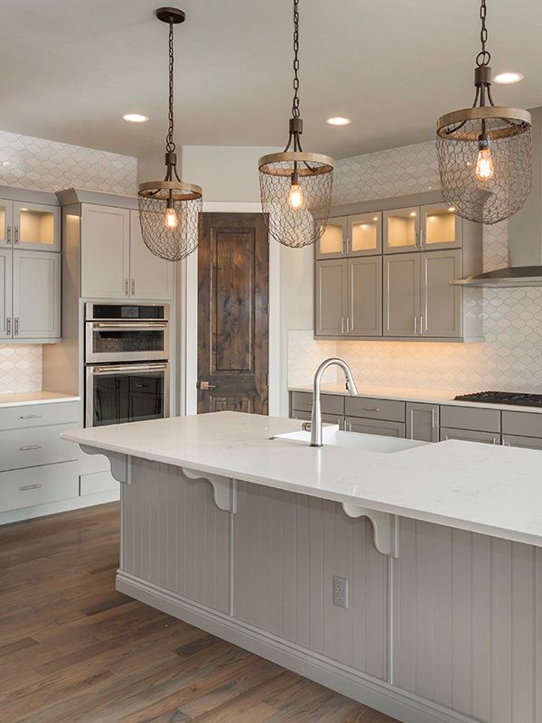 luxury kitchen interiors with white cabinets and modern lighting fixtures everett wa
